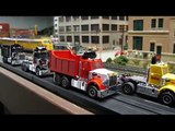 HO Scale Dump trucks racing on model railroad