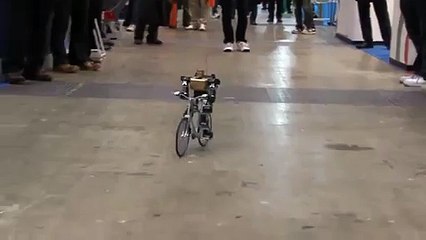 Robot rides a bike just like a man