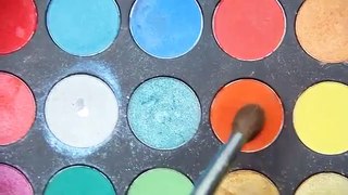 Orange eyeshadow and bold blue winged eyeliner eye makeup tutorial!