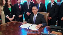 President Obama signs the 