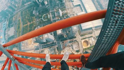 Daredevils free climb 2,165 foot skyscraper!