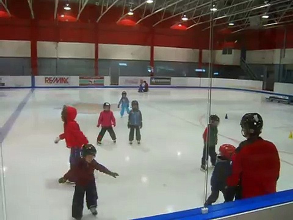 cute baby enjoys likes to be at the ice rink