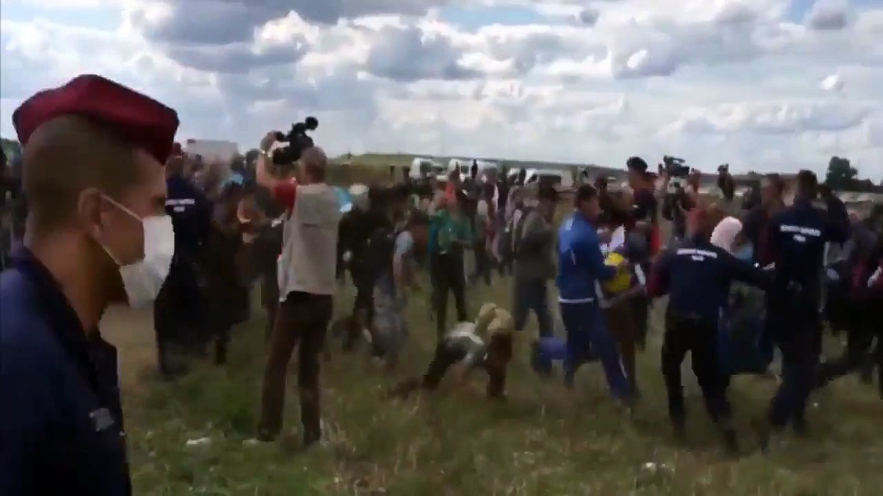 Hungarian camerawoman fired after intentionally kicking, tripping refugees