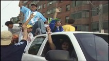 Brazilian Fans Riding on Trucks and Having a Wild Street Party