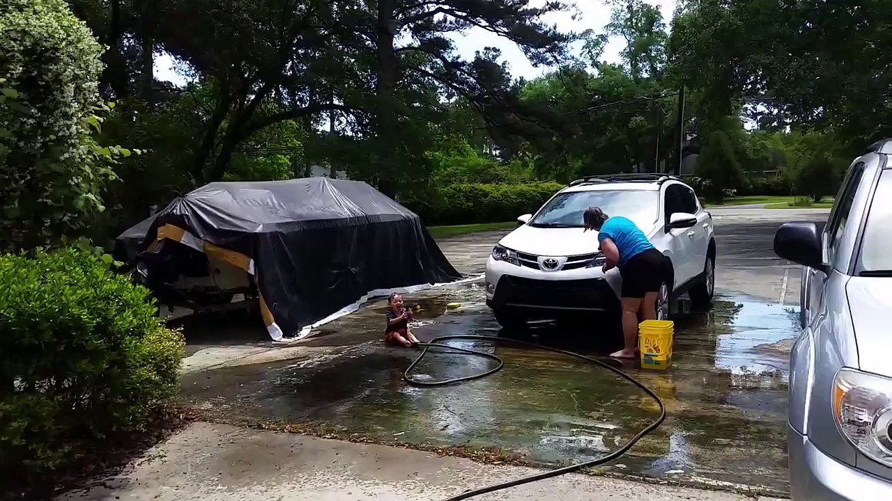 Eli helping Gram wash her car!