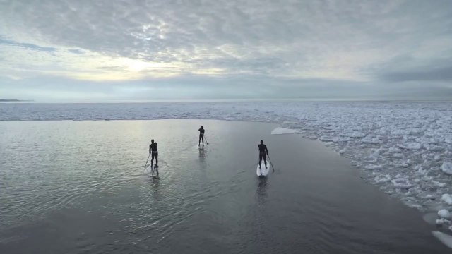 Winter paddle session among icebergs on Lake Michigan