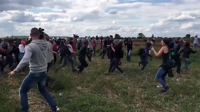 Hungarian Camerawoman Tripping Fleeing Refugees