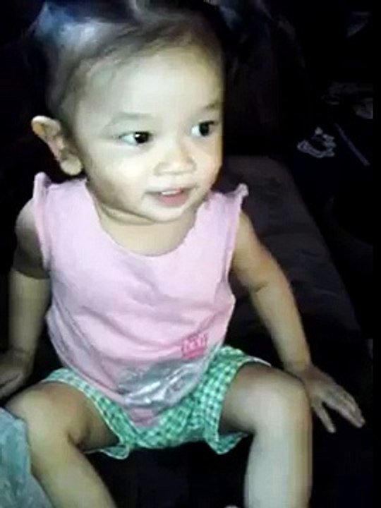 Baby Jasmine imitating the cartoon in TV.