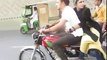 Pakistani Boy With A Girl Doing One Wheeling On Bike