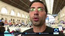 Stranded refugees leave Budapest train station on foot for Austria