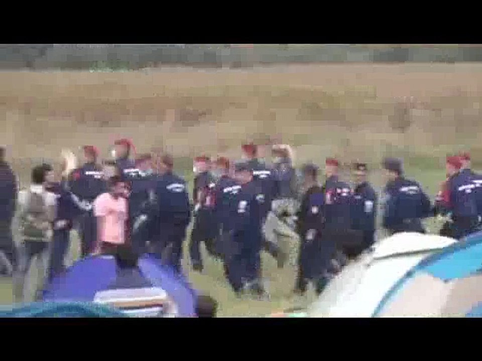 A Hungarian camerawoman fired after being caught on camera tripping refugees running from the police