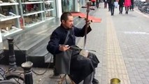 Blind Chinese musician playing strange violin instrument