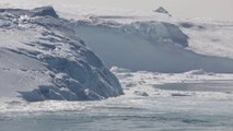 Massive Iceberg breaks in Greenland iced sea
