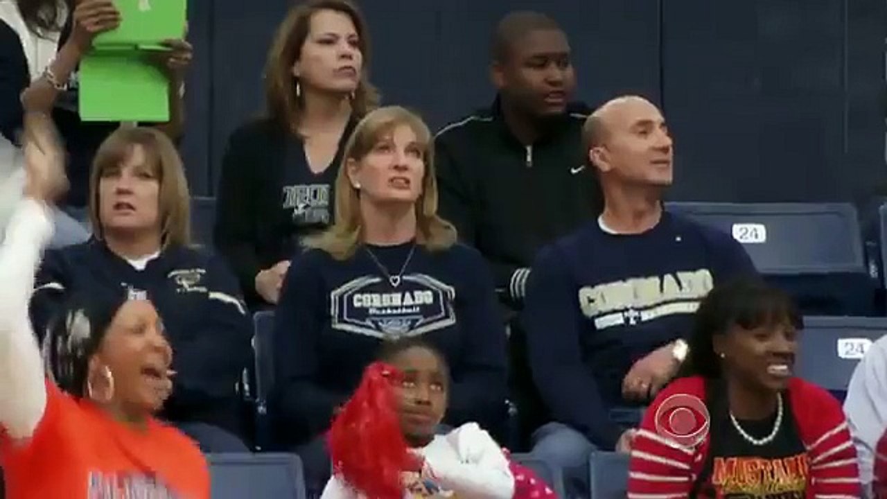 Touching moment basketball player from opposite team hands ball to disabled player