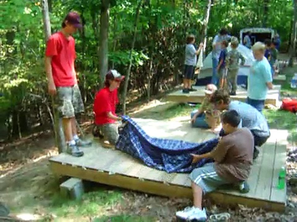 Boy Scouts demonstrate building a stretcher