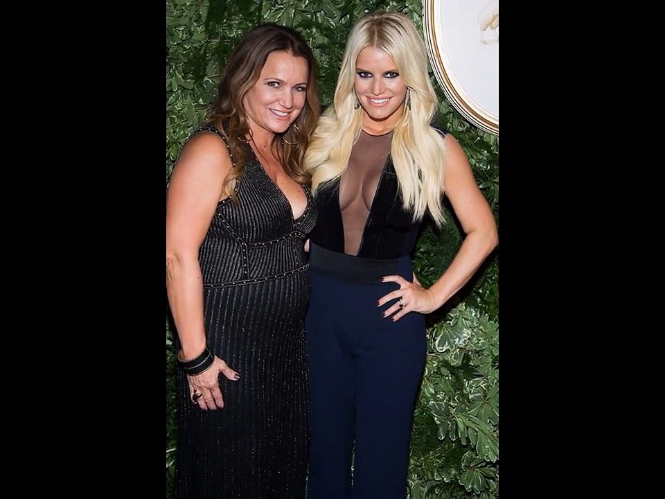 Jessica Simpson shows off ample CLEAVAGE AS she getting kiss fro m husband Eric