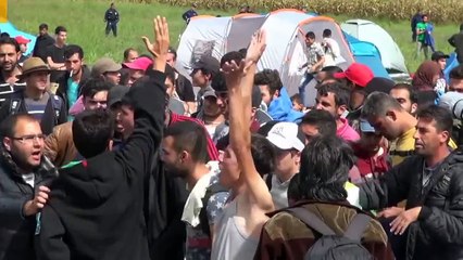 Hungarian camerawoman brutally kicking little refugee girl for fun