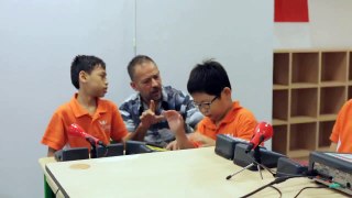 Phil Heeley and children from the Cerebral Palsy Alliance Singapore