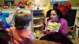 Caroline reading with Mommy, making animal sounds