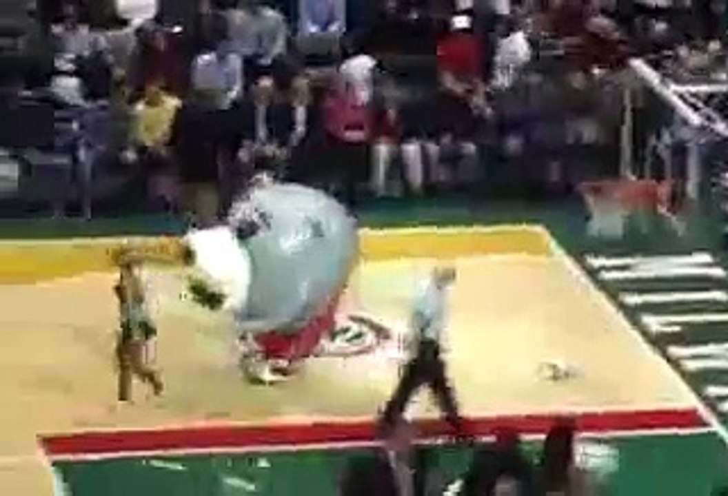 Funny mascot eats cheerleader
