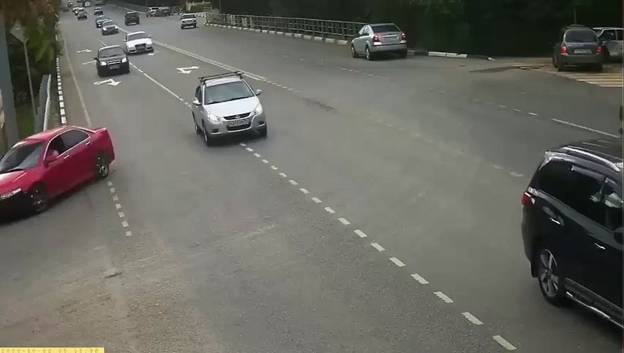 biker slams into turning car and almost flips it !