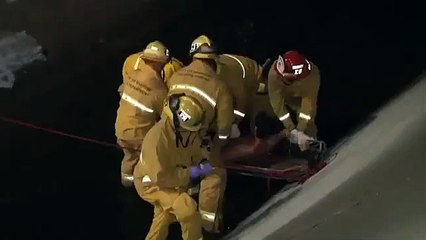 Bystander helps rescue man stuck in flood control channel - 2012-11-17