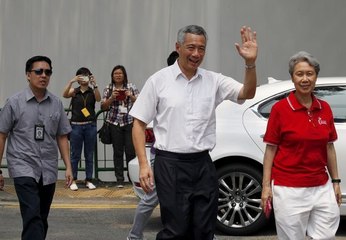 Singapore votes in hotly contested poll, though ruling party bound to win