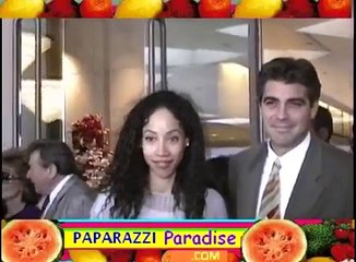 GEORGE CLOONEY and girlfriend KIMBERLY RUSSELL hold hands  - 1994