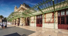 France, Nice, 08.09.2015: Facade of the Train Station Nice Ville, many people with suitcases, 4k