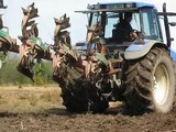 New Holland TM 165 and 4 sod reversible kverneland ploughing a Bog!