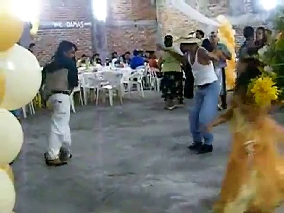 drunk men dancing at mexican party