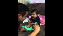 A dad cut his baby's nails