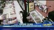 Cashier fights off sword wielding robber with BIGGER sword