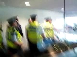 Police breaking down the door at an Auckland Uni protest