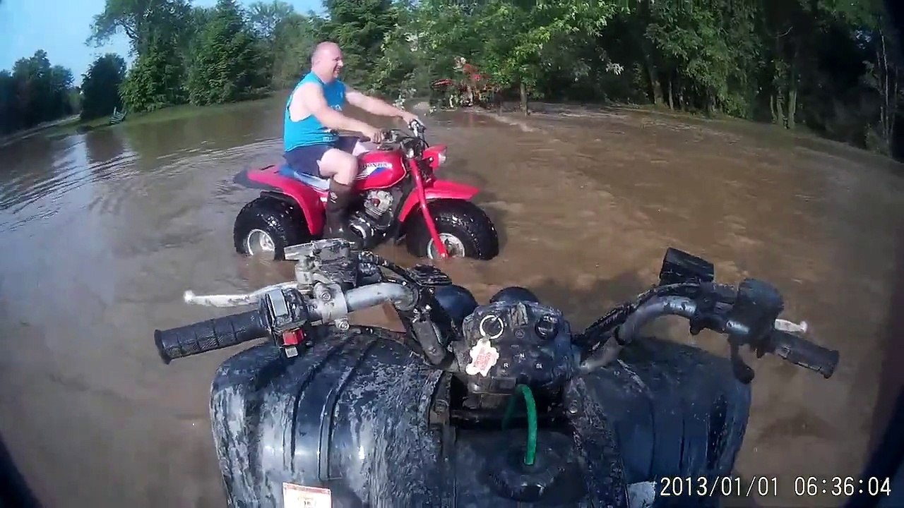 honda atc 125m and yamaha wolverine 350's in flood