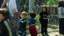 Refugees break through newly-built border fence in Hungary