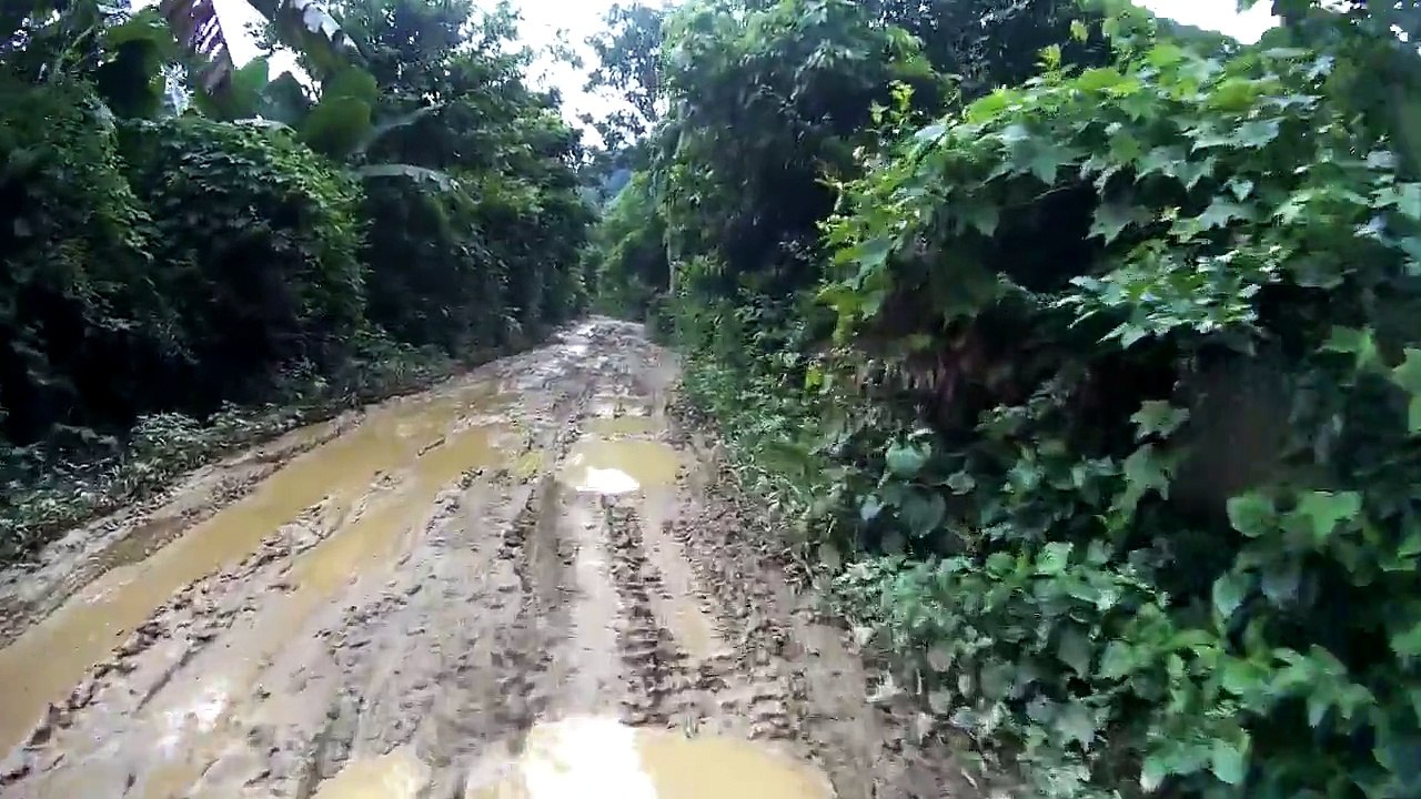 BMW F650GS offroad on muddy road in Vietnam 02
