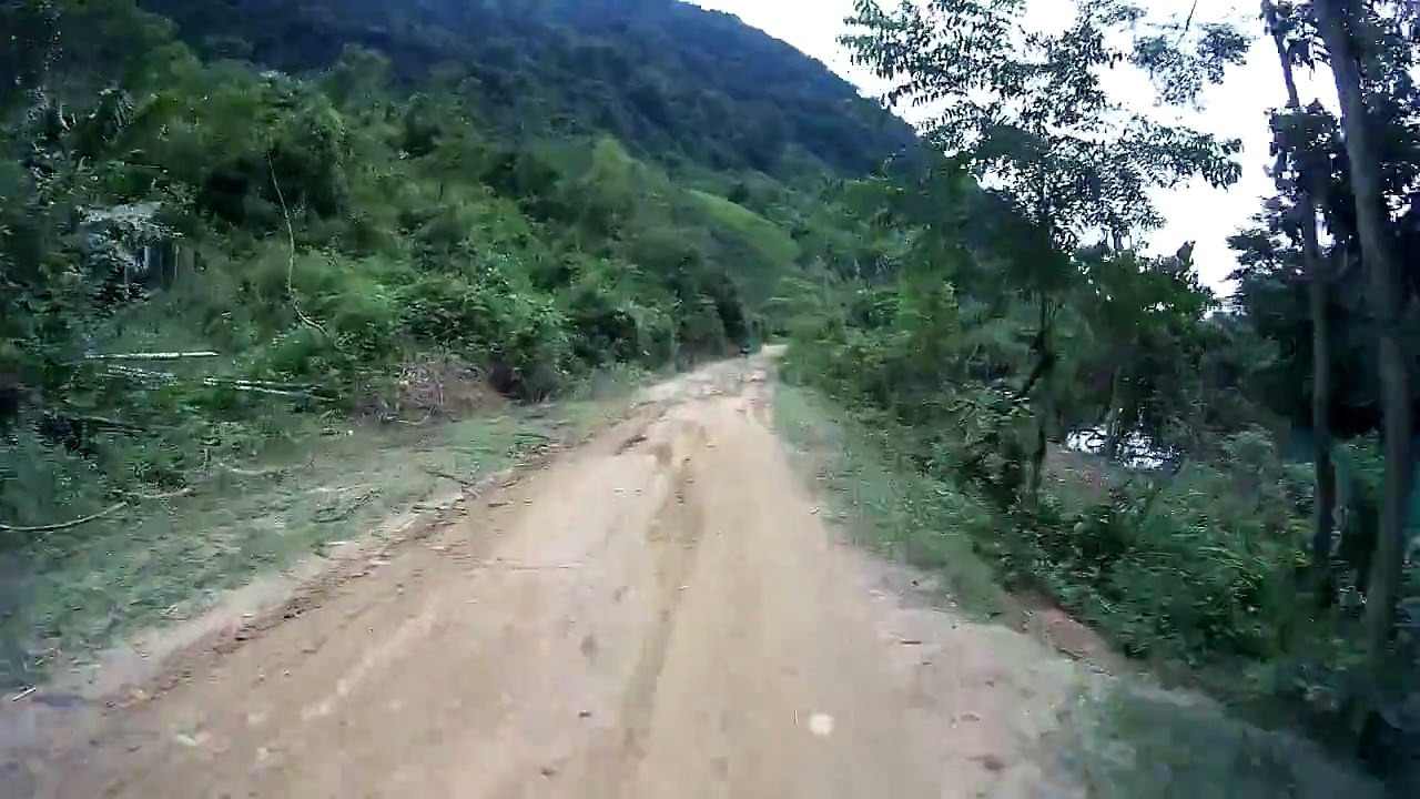 BMW F650GS offroad on muddy road in Vietnam 01