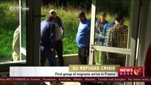 First refugees arrive in France as EU unveils plan for migrants