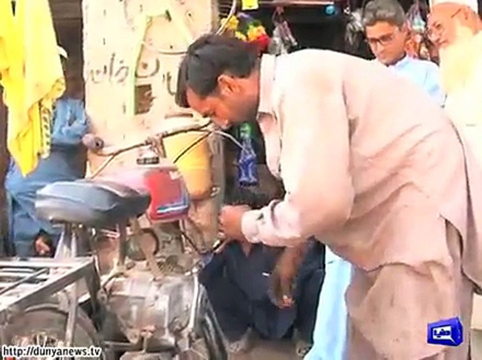 Man converts cycle into motorcycle.