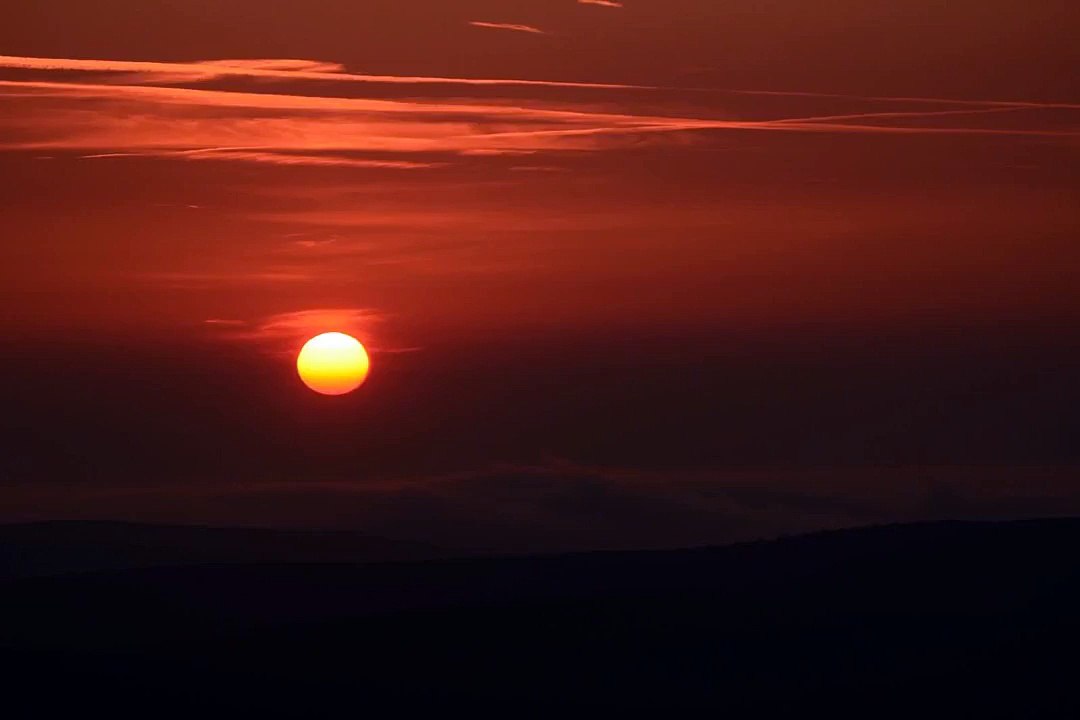 Fog waves at sunrise