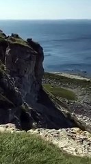 Incredible moment cliff vanishes into the sea after massive landslide in Dorset