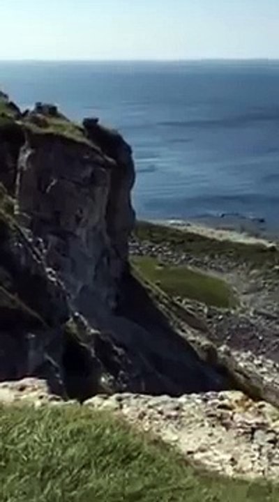 Incredible moment cliff vanishes into the sea after massive landslide in Dorset