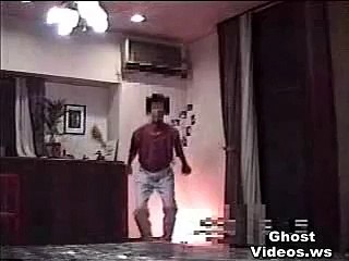 ghost-face-appears-from-behind-curtain-in-japanese-home