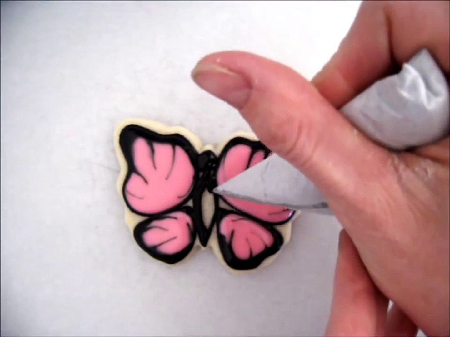 ⁣Pink and Black Butterfly Sugar Cookie with Royal Icing.