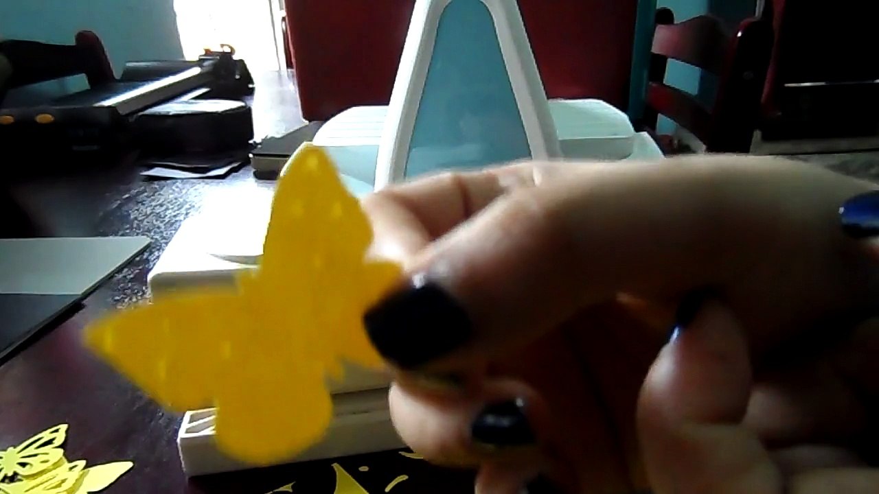 Cutting yellow and black butterflies using Martha Stewart layering punch