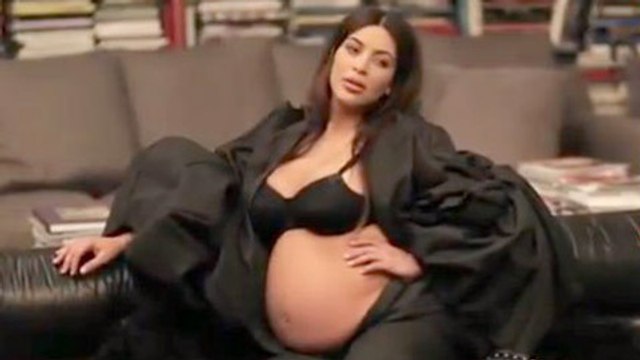 Kim Kardashian Covers Baby Bump in Sheer Dress at Givenchy Fashion Show