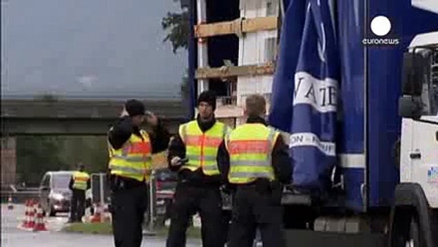 Migrants- queues build at border as Germany suspends Schengen