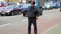 Drunk policeman is directing traffic