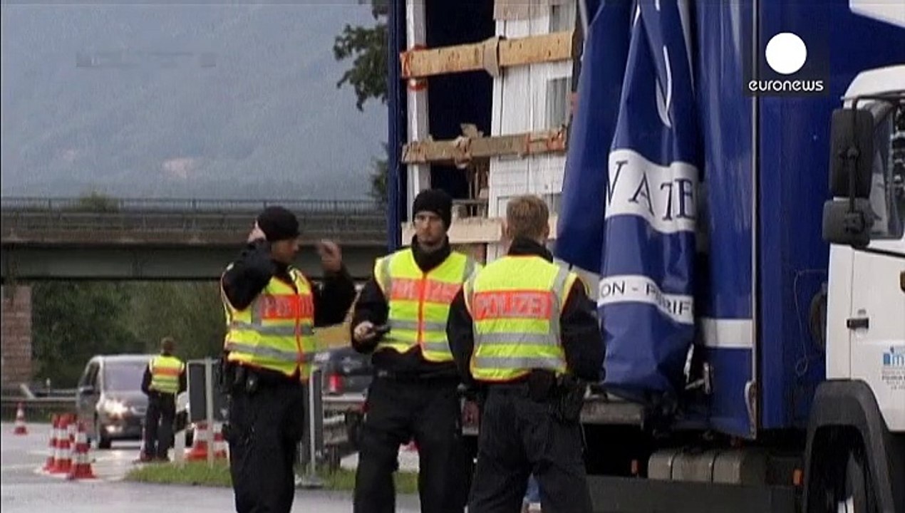 Migrants: queues build at border as Germany suspends Schengen
